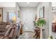 Inviting foyer with a decorative table and hardwood floors at 655 N Sobota Way, Trafalgar, IN 46181