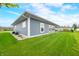 Exterior with lush green lawn and manicured gravel area at 655 N Sobota Way, Trafalgar, IN 46181