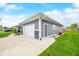 Exterior view of a house with blue siding, a concrete driveway, and a well-kept lawn at 655 N Sobota Way, Trafalgar, IN 46181