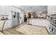 Spacious kitchen featuring stainless steel appliances, granite countertops, and ample cabinet space at 655 N Sobota Way, Trafalgar, IN 46181