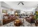 Spacious living room with leather seating, an area rug, and an open view into the kitchen at 655 N Sobota Way, Trafalgar, IN 46181