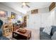 Comfortable living room with a ceiling fan, complemented by natural light and a cozy seating arrangement at 655 N Sobota Way, Trafalgar, IN 46181