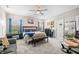 Main bedroom features ceiling fan, windows with curtains, and en suite bathroom at 655 N Sobota Way, Trafalgar, IN 46181