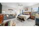 Large main bedroom featuring a seating area and a view of the en suite bathroom at 655 N Sobota Way, Trafalgar, IN 46181