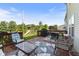 Outdoor back deck with outdoor seating and a playset in the backyard, great for entertaining at 6608 Sonesta Dr, Indianapolis, IN 46217