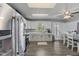 Bright kitchen featuring white cabinets, stainless appliances, and an open dining space at 6608 Sonesta Dr, Indianapolis, IN 46217