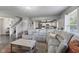 Comfortable living room showcasing a large sectional sofa and open layout to the kitchen at 6608 Sonesta Dr, Indianapolis, IN 46217