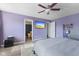 Spacious main bedroom features a ceiling fan, mounted TV, and an en-suite bathroom at 6608 Sonesta Dr, Indianapolis, IN 46217