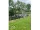 Scenic view of a tranquil pond with a fountain and lush green surroundings at 6730 Nw Shanghai Cir, Indianapolis, IN 46268