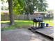 Outdoor space boasts a grill and a combination of brick and wood decking at 6801 Shalimar Ct, Indianapolis, IN 46214
