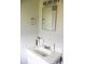 A bathroom vanity featuring a white sink, silver faucet, and ample counter space at 6801 Shalimar Ct, Indianapolis, IN 46214