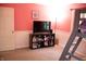 Cozy pink bedroom featuring a bunk bed, TV, and ample storage at 6801 Shalimar Ct, Indianapolis, IN 46214