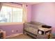 Cozy bedroom features a crib and changing table, perfect for a Bedroom at 6801 Shalimar Ct, Indianapolis, IN 46214