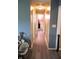 Hallway showcasing modern laminate flooring and neutral wall paint at 6801 Shalimar Ct, Indianapolis, IN 46214