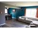 Bright living room featuring a modern sofa, hardwood floors, and natural light at 6801 Shalimar Ct, Indianapolis, IN 46214
