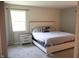 Comfortable main bedroom featuring a large window and neutral tones at 6801 Shalimar Ct, Indianapolis, IN 46214