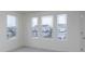 Bright bedroom with three large windows providing natural light and fresh paint at 7151 Firestone Rd, Whitestown, IN 46052