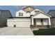 Beautiful two-story home with a two-car garage and a well-manicured lawn at 7151 Firestone Rd, Whitestown, IN 46052