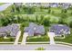Aerial view of home featuring lush lawn and landscaping and neighboring golf course at 780 Chatham Hills Blvd, Westfield, IN 46074