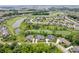 Stunning aerial of a luxury community highlighting golf course, pond, and perfectly manicured lawns at 780 Chatham Hills Blvd, Westfield, IN 46074
