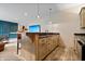 A finished basement featuring a wet bar with stone countertops and custom wood cabinetry at 780 Chatham Hills Blvd, Westfield, IN 46074