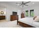 This bedroom features neutral colored walls, a ceiling fan, and a window overlooking a private outdoor space at 780 Chatham Hills Blvd, Westfield, IN 46074