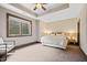 This bedroom offers neutral walls, a tray ceiling, and a carpeted floor creating a cozy and inviting atmosphere at 780 Chatham Hills Blvd, Westfield, IN 46074