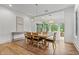 Dining room with modern lighting fixture and floor-to-ceiling windows offering ample natural light at 780 Chatham Hills Blvd, Westfield, IN 46074