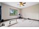 A spacious home exercise room with ceiling fan and abundant natural light at 780 Chatham Hills Blvd, Westfield, IN 46074