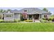 Charming home with lush green lawn, professional landscaping and a three-car garage at 780 Chatham Hills Blvd, Westfield, IN 46074