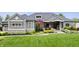 Charming home with lush green lawn, professional landscaping and a three-car garage at 780 Chatham Hills Blvd, Westfield, IN 46074
