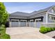 Spacious four-car garage with elegant trim and ample parking on a concrete driveway at 780 Chatham Hills Blvd, Westfield, IN 46074