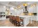 A modern kitchen with white cabinets, an island with seating, and stainless steel appliances at 780 Chatham Hills Blvd, Westfield, IN 46074