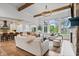 Open-concept living space with hardwood floors, fireplace, and seamless flow to kitchen and dining area at 780 Chatham Hills Blvd, Westfield, IN 46074