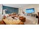 A finished basement featuring a large leather sofa and an entertainment center at 780 Chatham Hills Blvd, Westfield, IN 46074