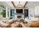 Inviting living room with stone fireplace, beamed ceiling, and stylish furnishings at 780 Chatham Hills Blvd, Westfield, IN 46074