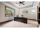 A home office with modern desk, chair, and tray ceiling at 780 Chatham Hills Blvd, Westfield, IN 46074