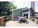 Back deck featuring wooden railing and a table with six chairs at 8023 Talliho Dr, Indianapolis, IN 46256