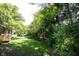 Backyard featuring green grass and thick trees at 8023 Talliho Dr, Indianapolis, IN 46256