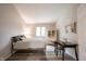 Bright bedroom with a modern desk, neutral walls, and plenty of natural light at 8023 Talliho Dr, Indianapolis, IN 46256