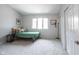 Neutral bedroom with light carpet, a black shelf, and window at 8023 Talliho Dr, Indianapolis, IN 46256