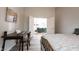 Comfortable bedroom featuring a stylish desk and a view into the cozy living room at 8023 Talliho Dr, Indianapolis, IN 46256