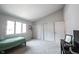 View of bedroom with light carpet, bed, and white closets at 8023 Talliho Dr, Indianapolis, IN 46256