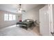 Spacious bedroom features a ceiling fan, large windows and neutral carpeting at 8023 Talliho Dr, Indianapolis, IN 46256