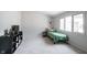 Neutral bedroom with light carpet, a black shelf, and window at 8023 Talliho Dr, Indianapolis, IN 46256
