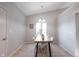 Bright dining room with tile floors, neutral walls, and large window views at 8023 Talliho Dr, Indianapolis, IN 46256