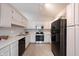 Bright kitchen featuring white cabinets, stainless steel appliances, and ample counter space at 8023 Talliho Dr, Indianapolis, IN 46256