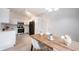 Eat-in kitchen featuring stainless steel appliances, white cabinetry, and modern finishes at 8023 Talliho Dr, Indianapolis, IN 46256