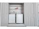 Laundry closet with stacked washer and dryer at 8023 Talliho Dr, Indianapolis, IN 46256