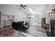 Bright living room with vaulted ceilings, fireplace, skylight, and modern decor at 8023 Talliho Dr, Indianapolis, IN 46256